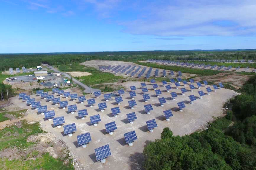 Sky view of a field of solar panels.